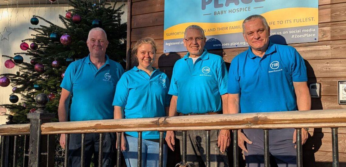 TIB Services staff stand in front of Zoe's Place Baby Hospice