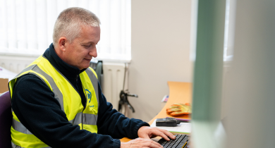 A TIB operative types on a computer